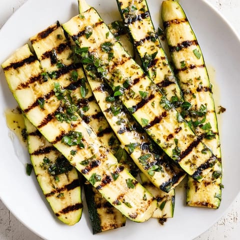 Freshly grilled Garlic Herb Zucchini, a vibrant side dish ready for a summer barbecue.