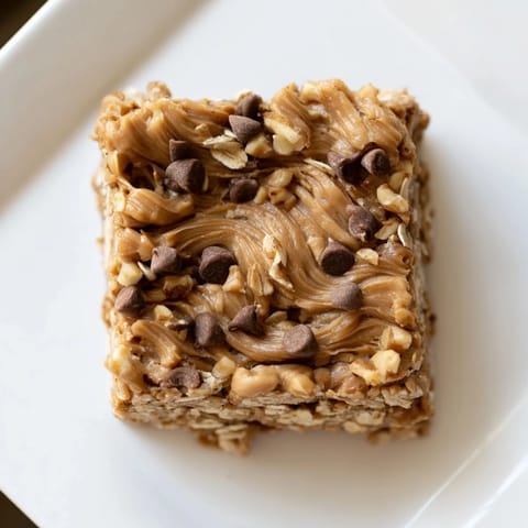 A close-up of Peanut Butter Banana Oat Bars, showing the texture of wholesome, layered ingredients.