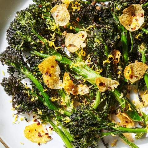 Freshly made charred broccolini salad, featuring air-fried broccolini, lemon, and a tasty garlic crunch.