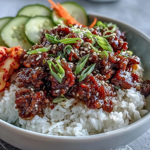 Korean Ground Beef Bowl with spicy gochujang beef, edamame, and sesame seeds over steamed rice.