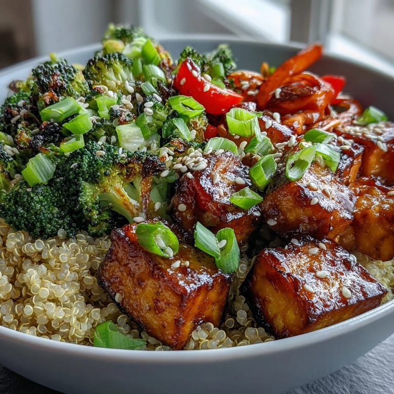 A vibrant vegan and gluten-free Quinoa Vegetable Teriyaki Bowl features tender snap peas and julienned carrots mixed with savory quinoa, showcasing a nutritious and satisfying plant-based dinner.