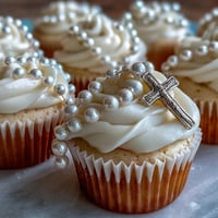 Adorable mini vanilla cupcakes topped with smooth buttercream and fondant rosary toppers, ideal for First Communion celebrations.